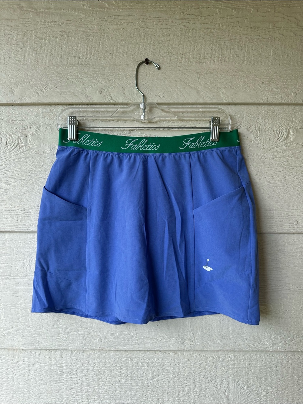 Blue Fabletics athletic skort with green waistband